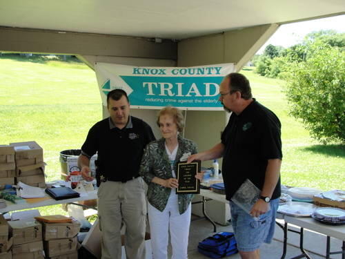 Carol Young receiving an award